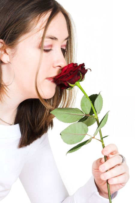 girl smelling rose