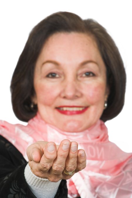 business woman with her hand up front holding something in front of her. Focus on hand