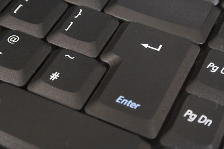 black enter key shallow depth of field, focus on arrow on the enter key