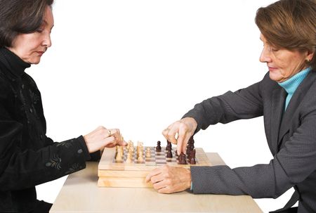 Business females playing chess over white
