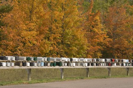 Row of mailboxes (identifiers removed) on a fall day in northern Michigan