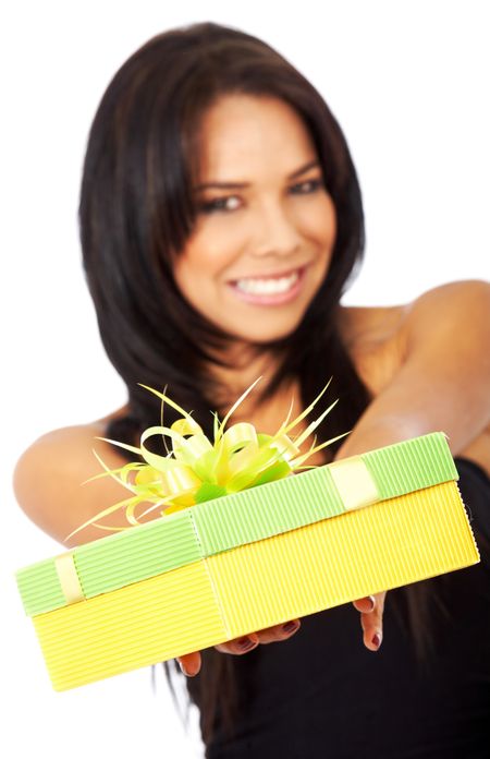 woman offering a gift smiling - isolated over a white background