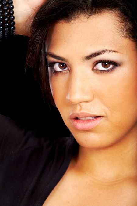 black fashion woman portrait with make-up over a dark background