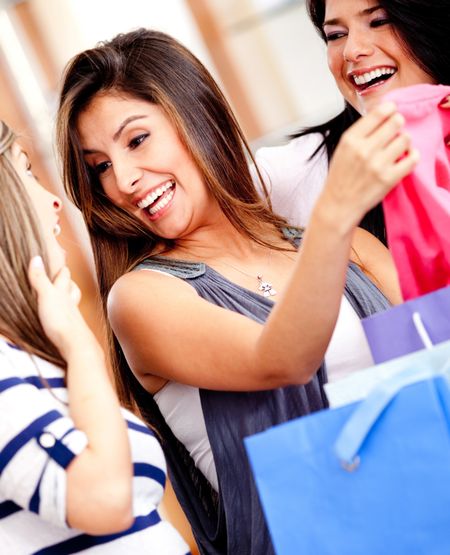 Happy female friends shopping at a retail store