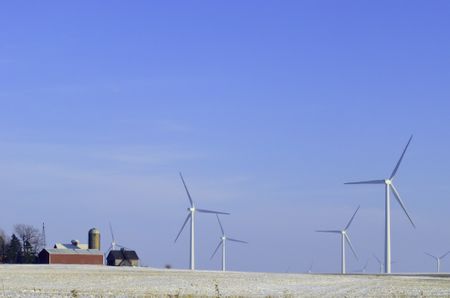 Skyscrapers in the countryside: Wind turbines on wintry farmland in Illinois