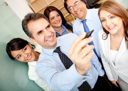 Business team writing on an imaginary screen at the office