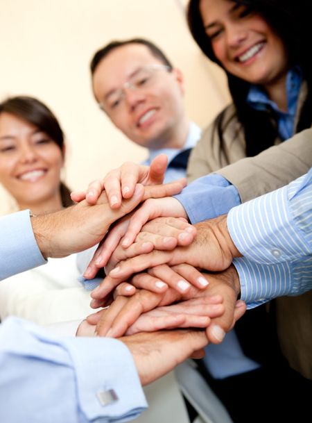 Business group with hands together - teamwork concepts