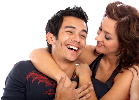 happy couple of young adults portrait smiling isolated over a white background