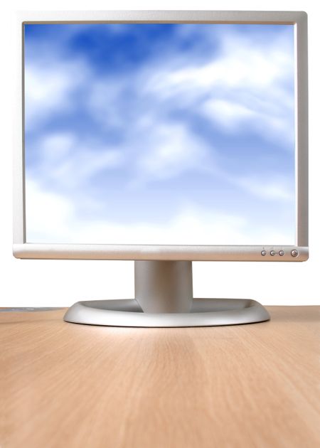 monitor on desk with a blue sky