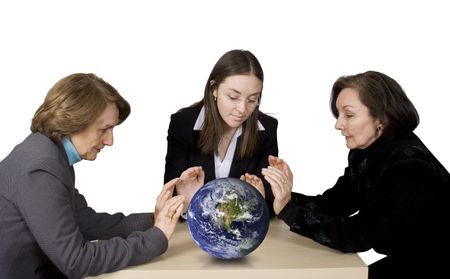 Business female management team with hands over earth globe
