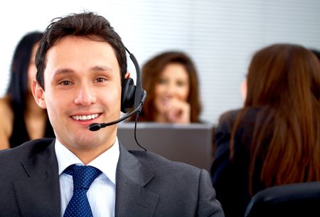 customer service representative man - smiling in his office