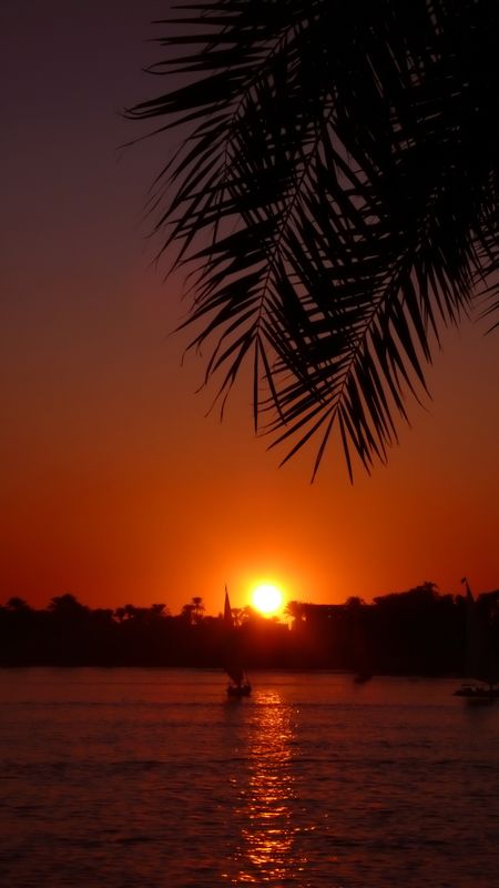 beautiful sunset in orange tones in front of a river