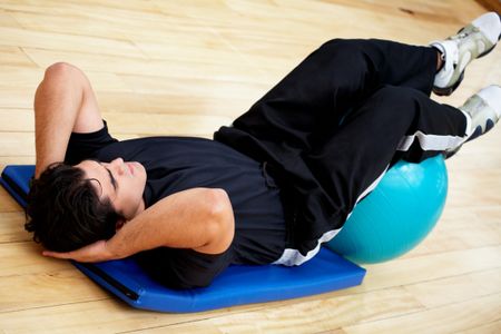 man at the gym doing abdominal exercises
