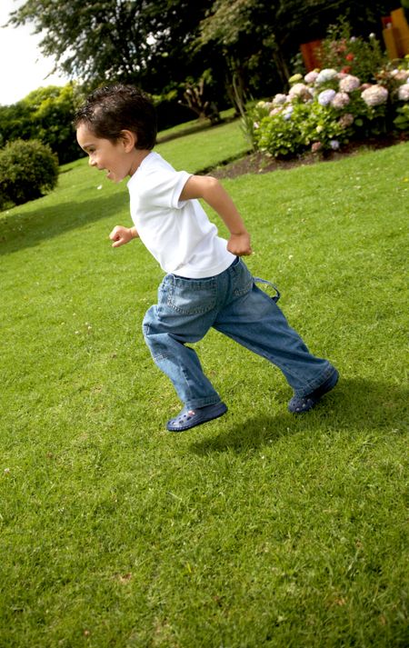 happy child running outdoors in a park
