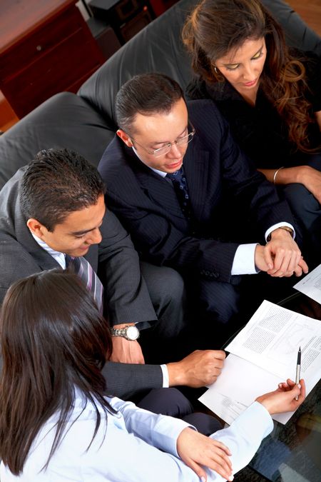 business meeting in an office with businessmen and businesswomen