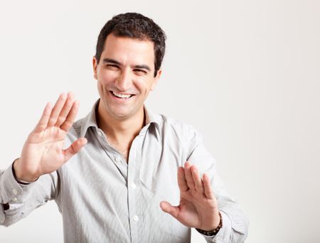 Man touching an imaginary screen - isolated over a white background