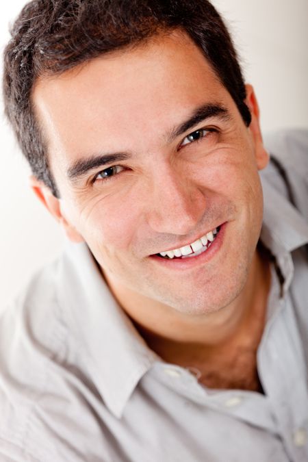 Handsome man portrait smiling - isolated over a white background