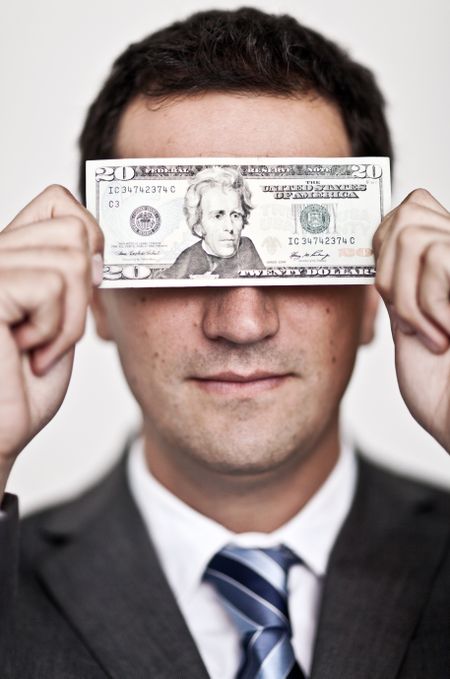 Business man blinded by the money - isolated over a white background