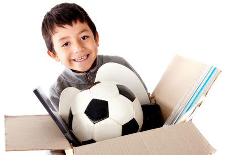 Boy moving house holding a box with his belongings - isolated white background