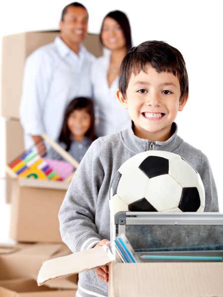 Family moving house and a boy holding a box with toys - isolated over a white background