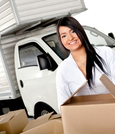 Woman moving house carrying boxes - isolated over a white background