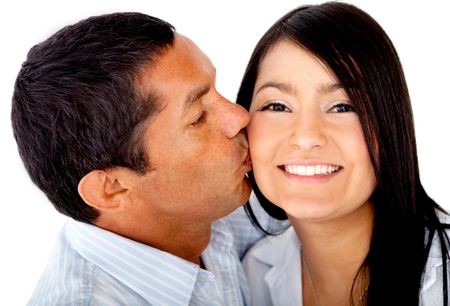 Loving couple kissing - isolated over a white background