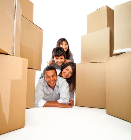 Family moving house with cardboard boxes - isolated over a white background