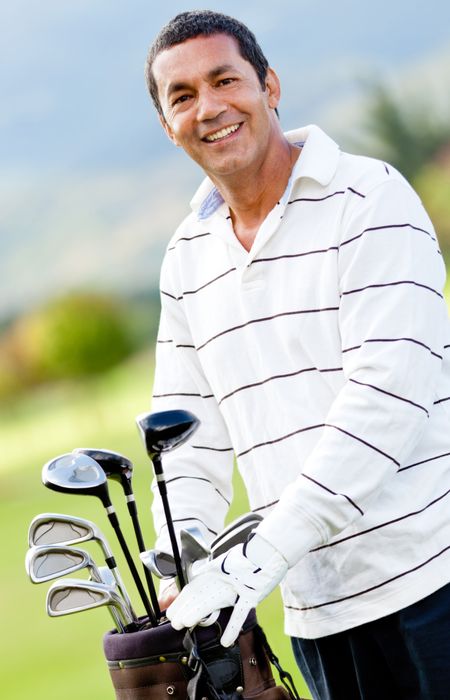 Male golf player with a sack at the course