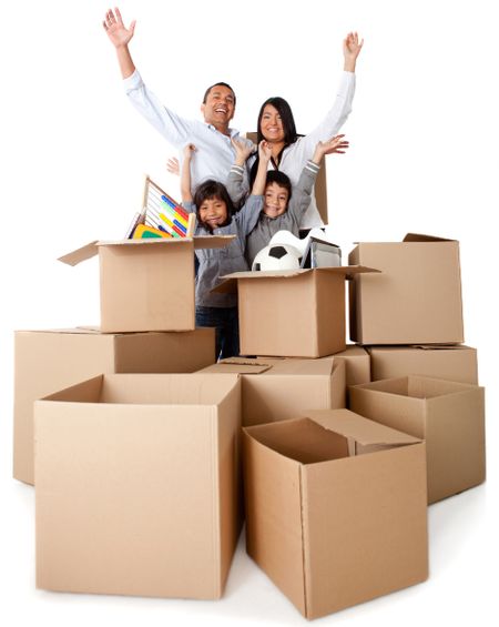 Family excited about moving with arms up and cardboard boxes
