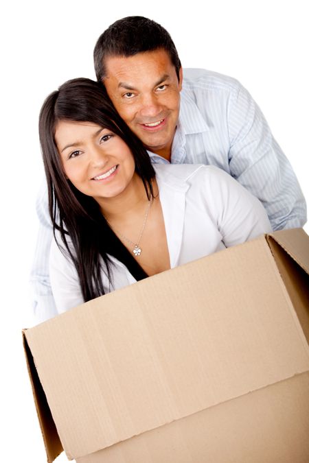 Loving couple moving house and packing in boxes - isolated over white