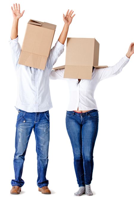 People with cardboard boxes on their heads simulating a hectic moving â?? isolated