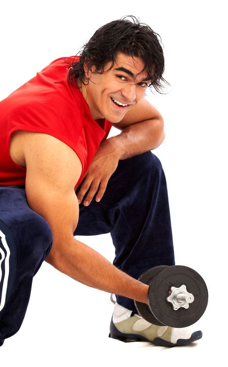 fitness man doing free weights exercises isolated over a black background