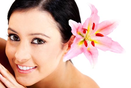 Beauty portrait of a woman with a flower on her head - isolated over a white background
