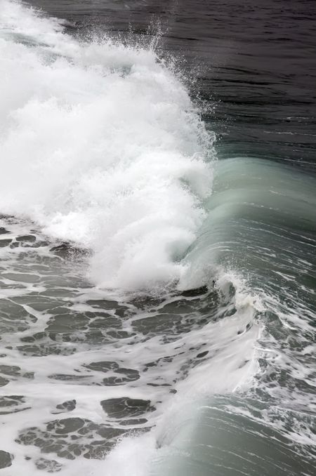 Wave crashing toward shore