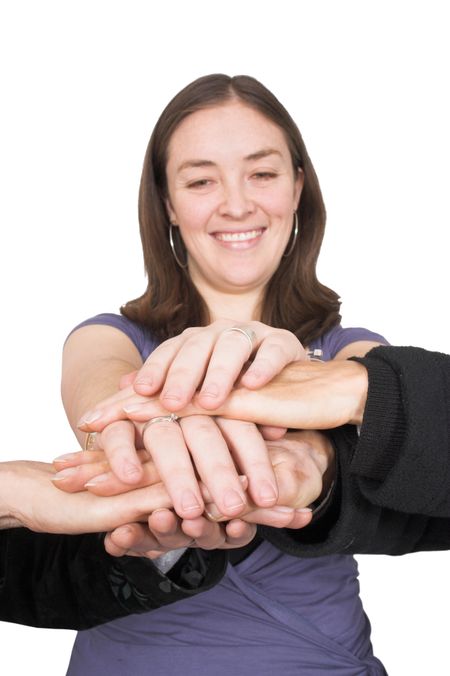 business team with their hands together - face of one of the women