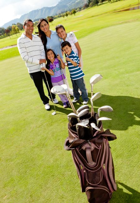 Family at the golf field looking happy