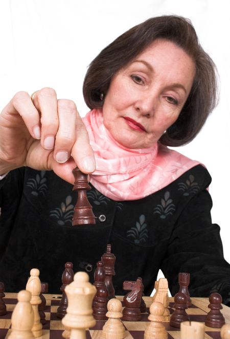 business woman playing chess over a white background