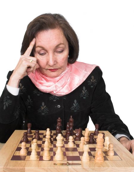 business woman planning her next move on a chess game