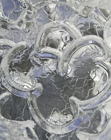 Abstract in ice: Macro of frozen texture reflecting ambient light outdoors