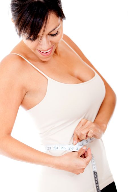 Woman taking measurements with a tape - lose weight concepts