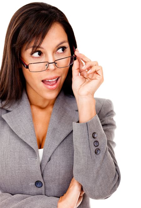 Surprised business woman looking to the side and holding glasses - isolated