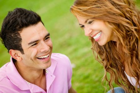 Happy loving couple enjoying their time together - outdoors