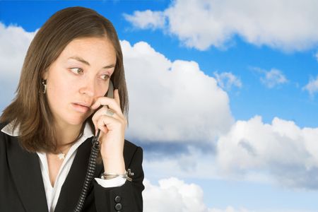 business woman on the phone with the sky on the background
