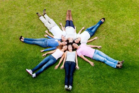 Group of young people lying down outdoors