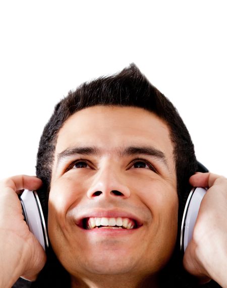 Happy man portrait listening to music - isolated over a white background