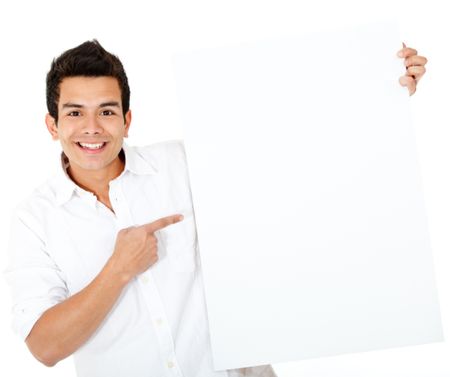 Casual man pointing at a banner and smiling - isolated over white