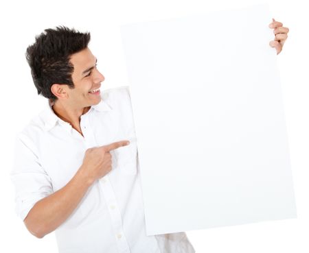Casual man pointing at a banner - isolated over a white background