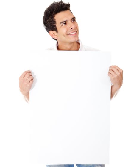 Casual man holding a banner and smiling - isolated over a white background