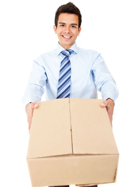 Business man delivering a package and smiling - isolated over a white background