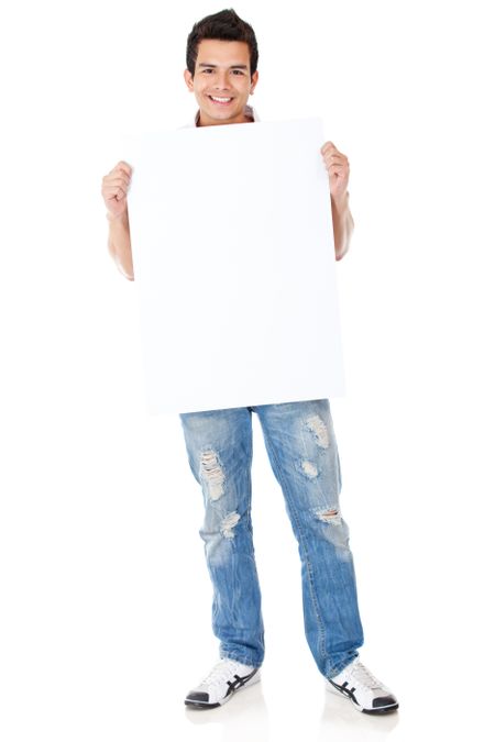 Casual man standing and holding a banner - isolated over white